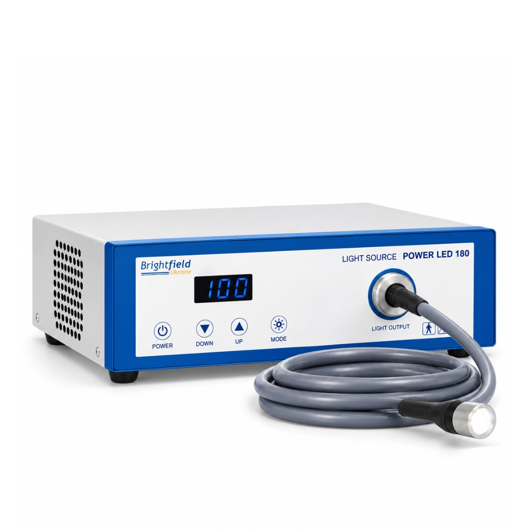 Brightfield POWER LED 180 endoscopy light source, left three-quarter view showing ventilation openings, front control panel and fiber optic light guide